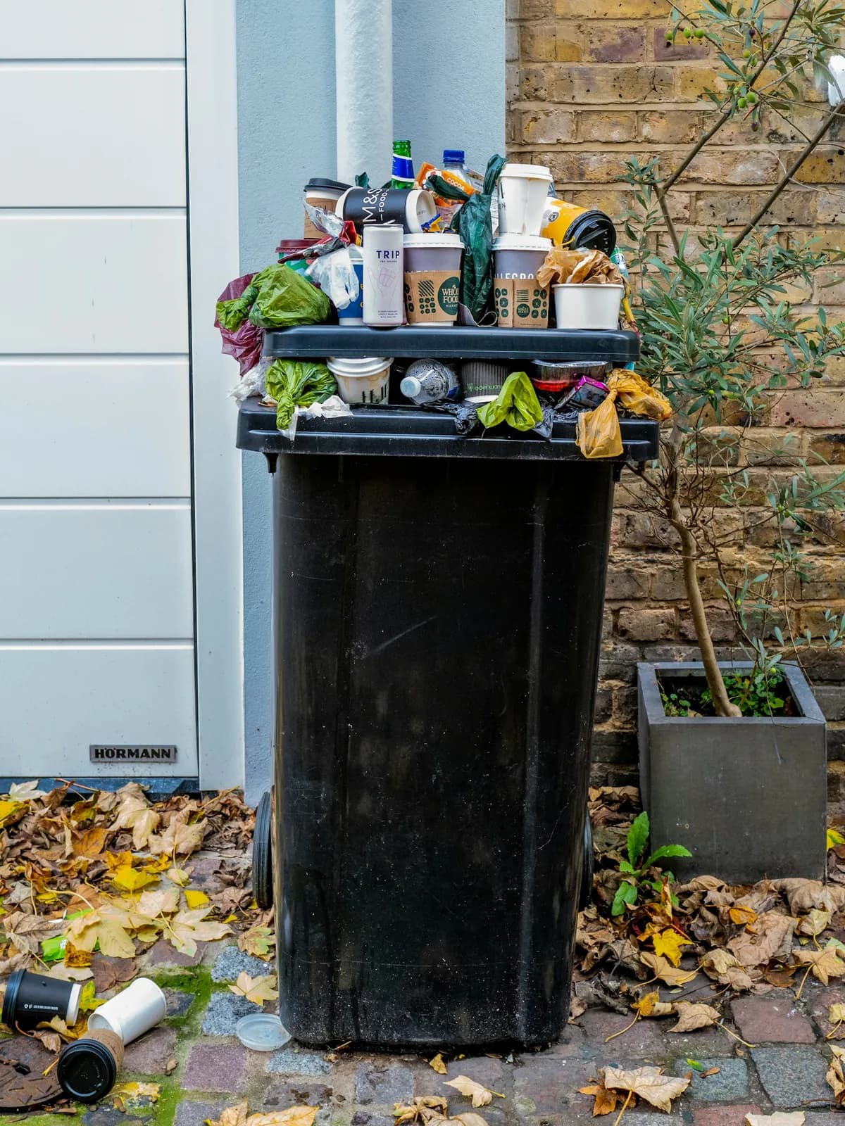 Public bin missing outside the new bus stand. People are dumping garbage at the 